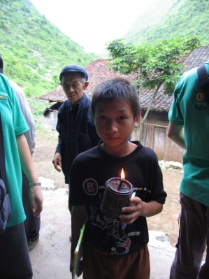 boy holding kerosene lamp